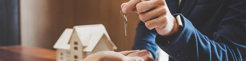 Landlord giving the keys to his new tennant 